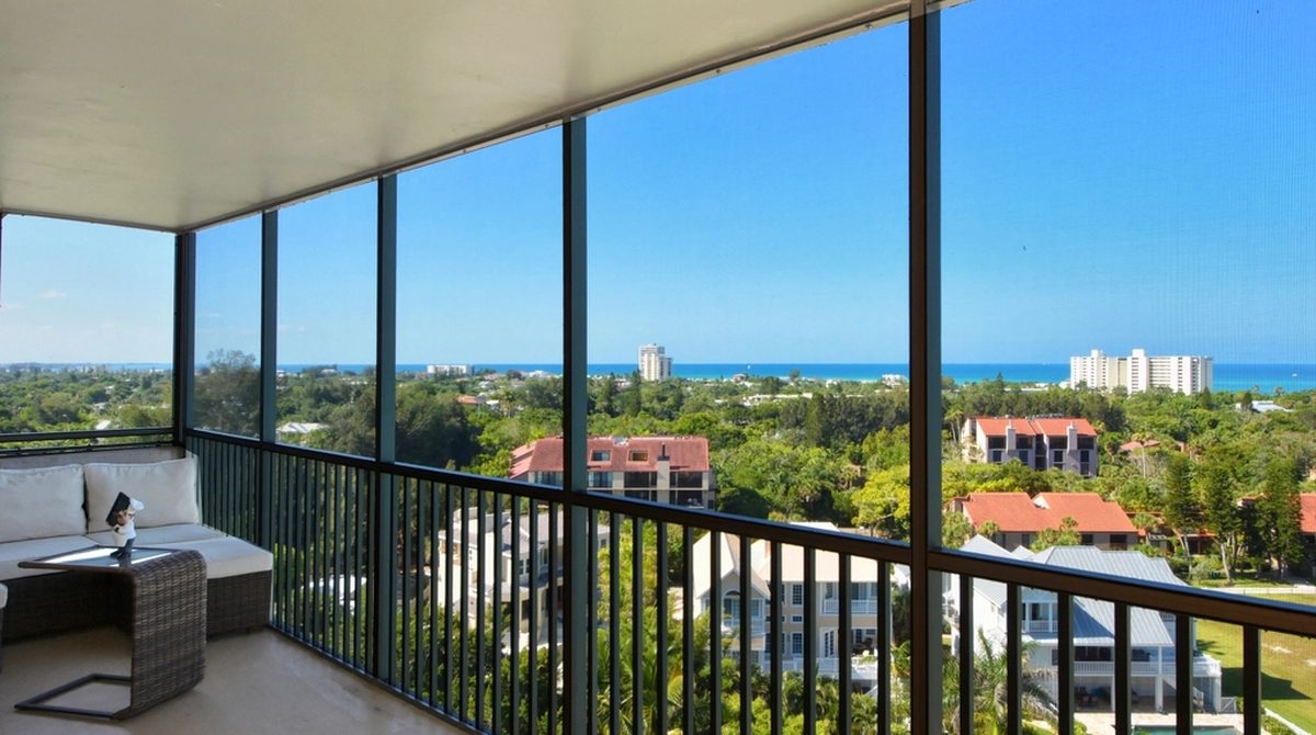 An empty condo residence with an ocean view, waiting for a buyer